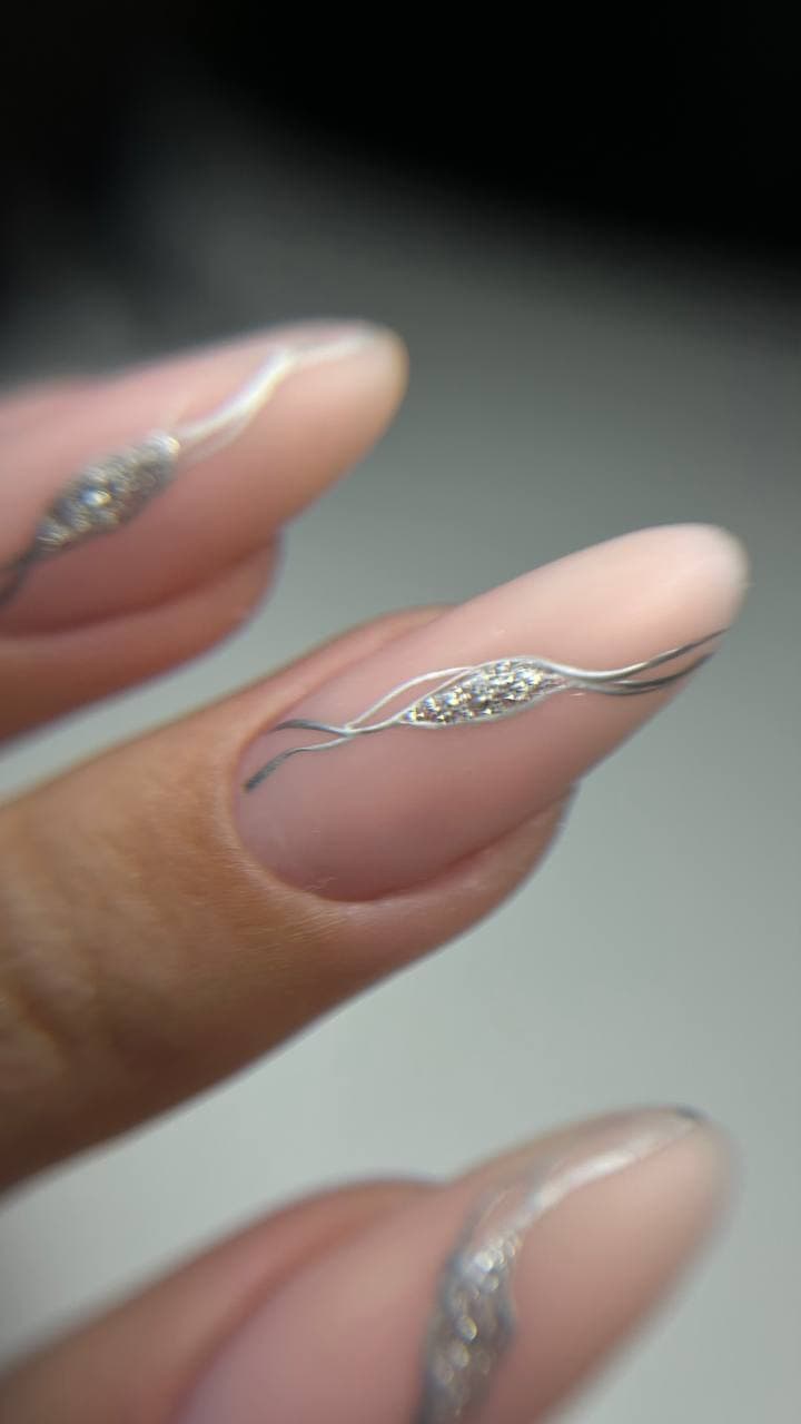 Nude almond nails with silver foil accent — nail salon Kraków